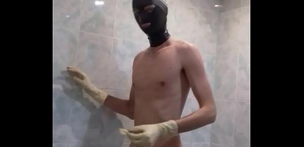  guy wanks in condom and medical gloves